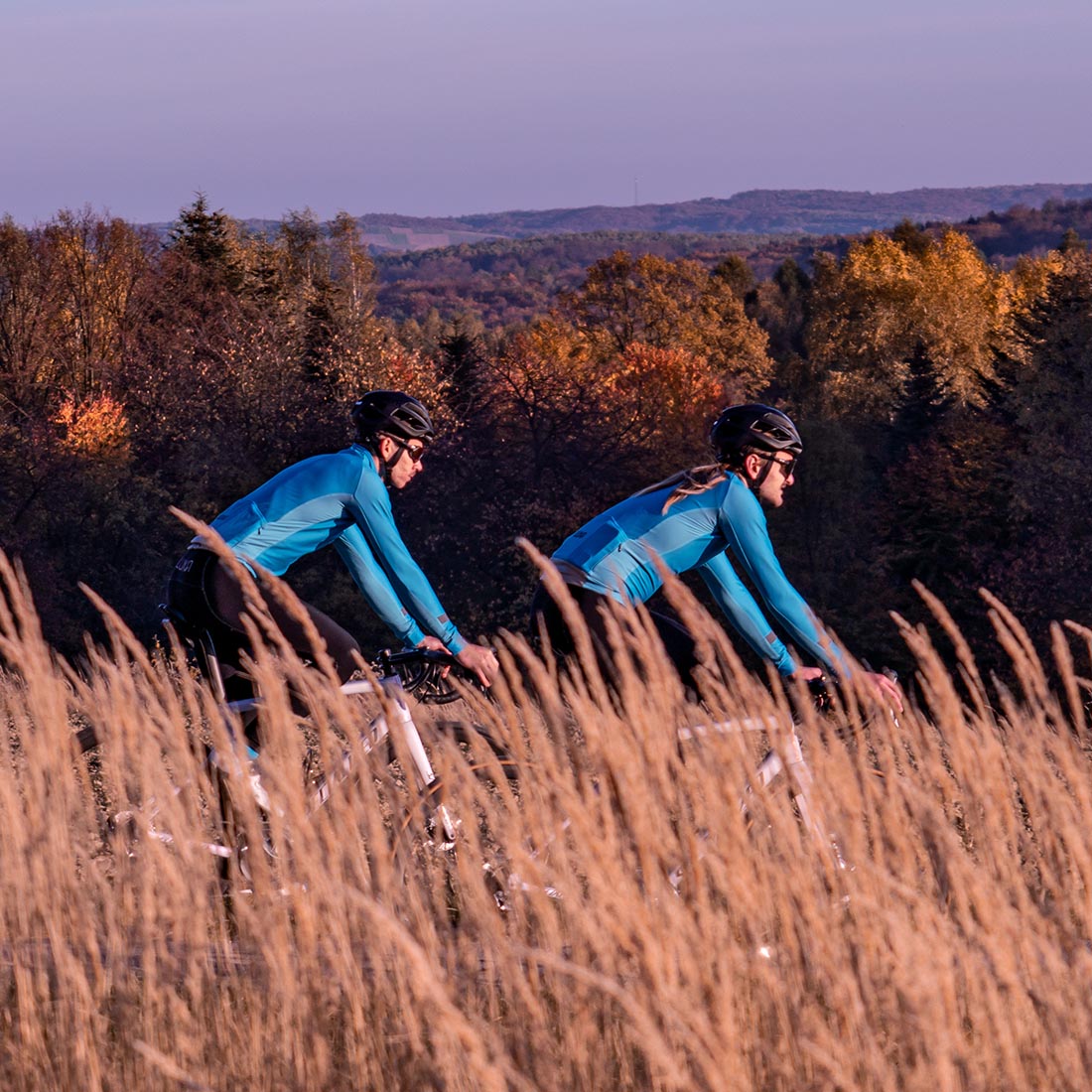 two road cyclists wearing warm premium cycling clothing made in Europe